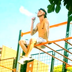 Fitness Enthusiast Chilling on a Parkour Rig