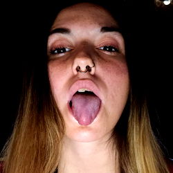 Woman in Red and Blue Plaid Shirt with Tongue Out