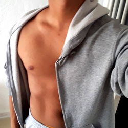 Fitness Model Showcasing Abs and Hoodie Fashion