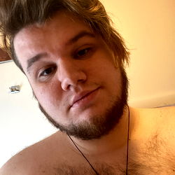 Bearded Man in Tank Top with Shaved Head