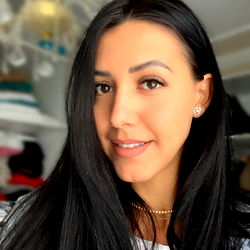 A Young Woman Smiling at the Camera