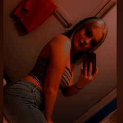 Model Posing in Bathroom Mirror