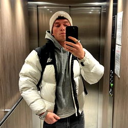 Antony's Confident Pose in Elevator