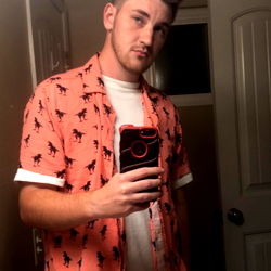 Young Man in Plaid Shirt and Orange Tie