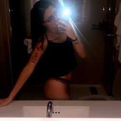 Intimate Moment in Bathroom Mirror