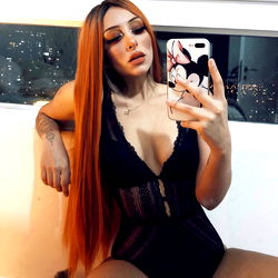 OnlyFans Model in Lingerie Taking a Selfie