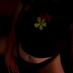 A captivating OnlyFans model, Momster51015, showcasing her allure in a dark room