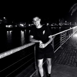 Noah Posing on the Dock at Night