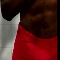 Fitness Model Alexis Showcasing Red and Black Swimwear