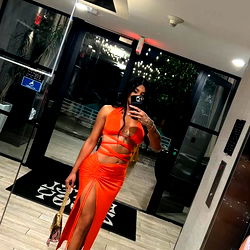 Ariana Model Striking a Pose in an Elegant Dress