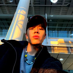 Kevin, A German Influencer Posing With Airport Backdrop