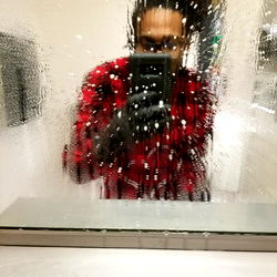 Man Taking Selfie in Bathroom Mirror