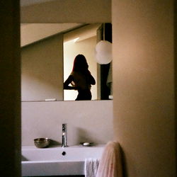 Model in Bathroom Mirror