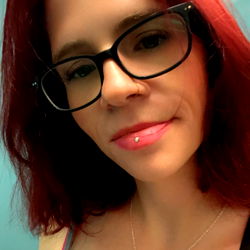 Vivid Red-Headed Lady in Glasses