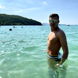 Fitness Model Poses for Photos at Beach in Dubai