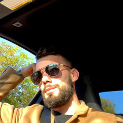 Apollo, a San Diego, CA Onlyfans Model in a Sporty Car