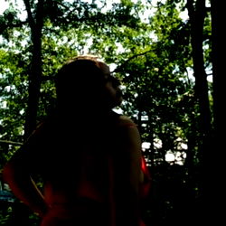 Sunny Marie in a serene woodland setting