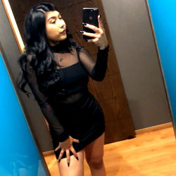 Alejandra in a stylish black dress