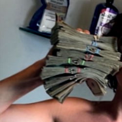 Social Media Influencer Showcasing Financial Success