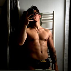 Fitness Model in Bathroom Mirror