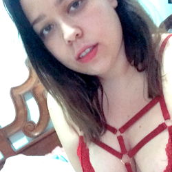 Karla Casas, a model from Mexico, striking a pose in a red lingerie