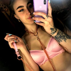 Onlyfans Model Maia 🦄 Poses in Pink Lingerie and Holding a Phone
