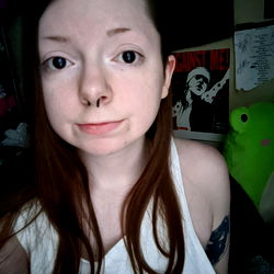 A young woman with a nose piercing