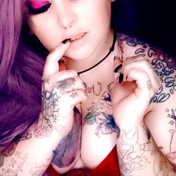 TattooedJuliet90, a Model with Striking Purple Hair and Tattoos