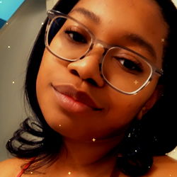 Woman in Glasses Smiling at Camera