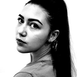 Anissa, an OnlyFans Model: Posing with a Dual-Tone Backdrop for Promotional Material