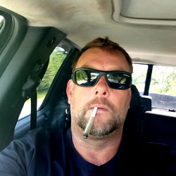 Bearded man with sunglasses holding cigarette, 420