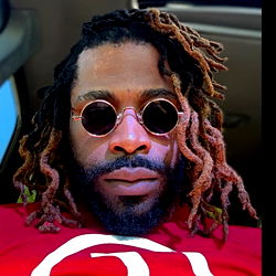 Stylish Individual in Sunglasses and Oversized Earrings