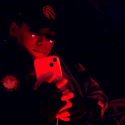 Deci, an OnlyFans model in red lighting