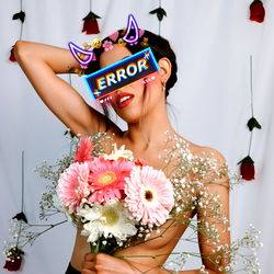 Model Posing with Flowers, Wearing Fancy Headpiece