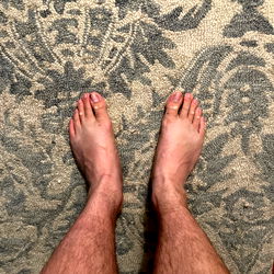 Feet in Socks on Carpeted Floor