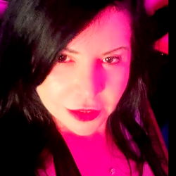 Mistress Lola, a Miami-based OnlyFans model posing for a promotional photo on the dance floor