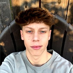 Young Man with Short Hair and a Tattoo, Posing for Selfie