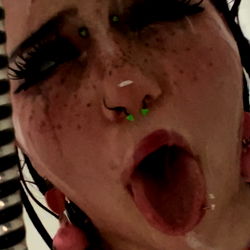 Pirhana, the Onlyfans sensation poses with a playful water spray effect.