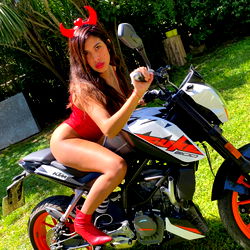 Onlyfans model poses on a motorcycle