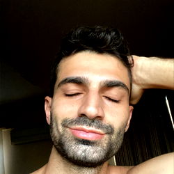 Casually Resting Man in Trendy Pose