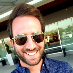 Michigan Man in Sunglasses Posing for Photo at Airport