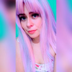 Fashion-forward Female with Rainbow Hair and Pink Lipstick