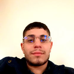 Alessio Ruggiero: A Young Man with Glasses