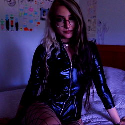 Model in Cat Ears Sitting on Bed