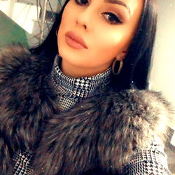 Stylish Model in a Grey Fur Coat