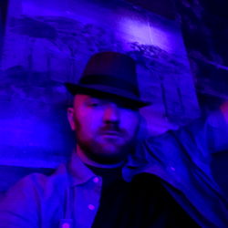 Man in Fedora Posing for Photo