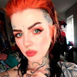 Sleezy Kunst, A Tattooed Model with Red Hair and a Piercing