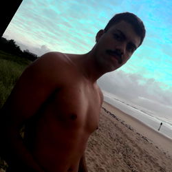 Shirtless Man at Beachfront