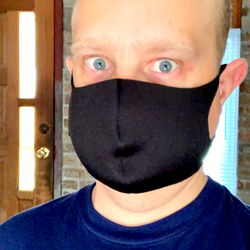 A man donning a face mask