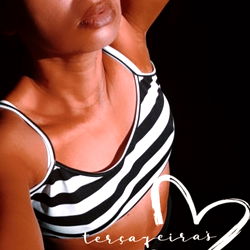 Alluring Lisa Versalli: Glowing in a Chic Black and White Striped Tank Top